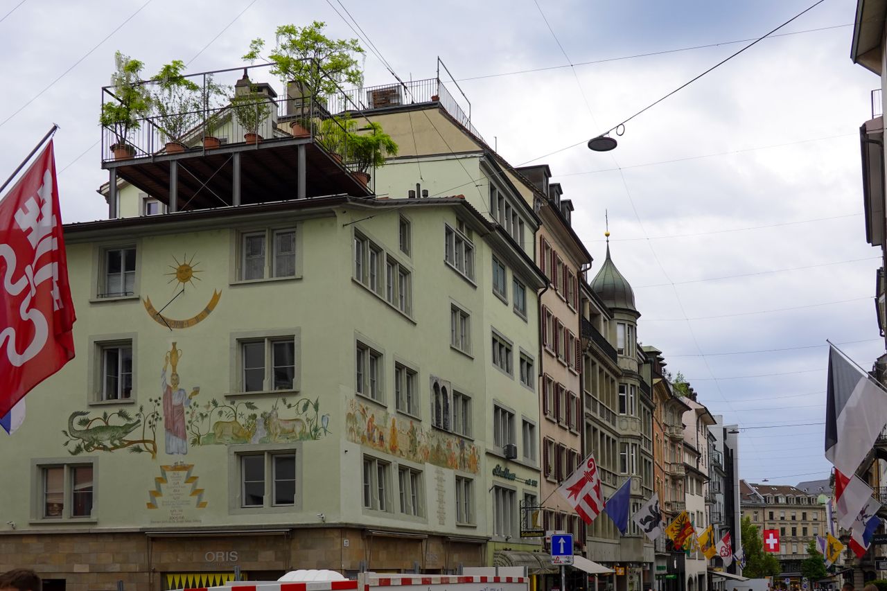 gallery-5 Picturesque Zurich old town showcasing historic architecture and vibrant city life.