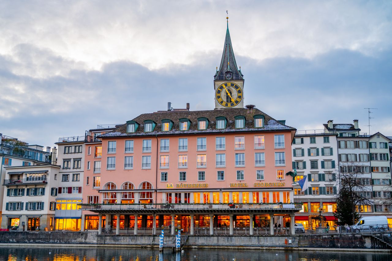 gallery-4 Charming Zurich architecture on display during twilight along the waterfront.